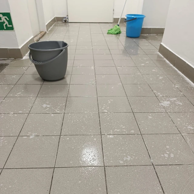 During: Wet cleaning of tiles and grout.